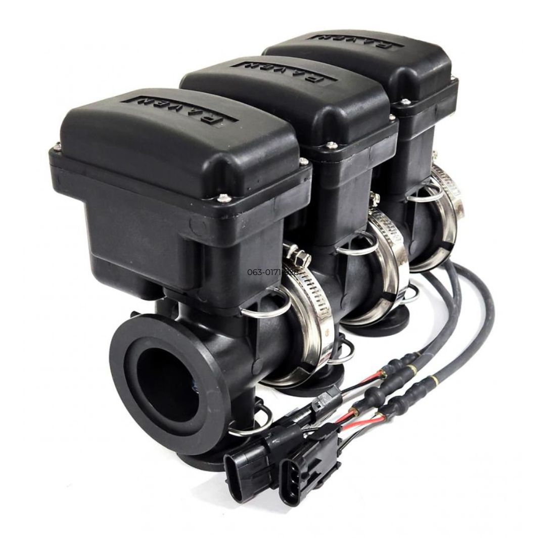 Three Raven 3 Section On/Off Manifold Valves, Model M200 X M100 / 3/4 FPT, in black, are integral to fluid control systems and are connected by wires. They are aligned in a row with metal clamps securing the components.