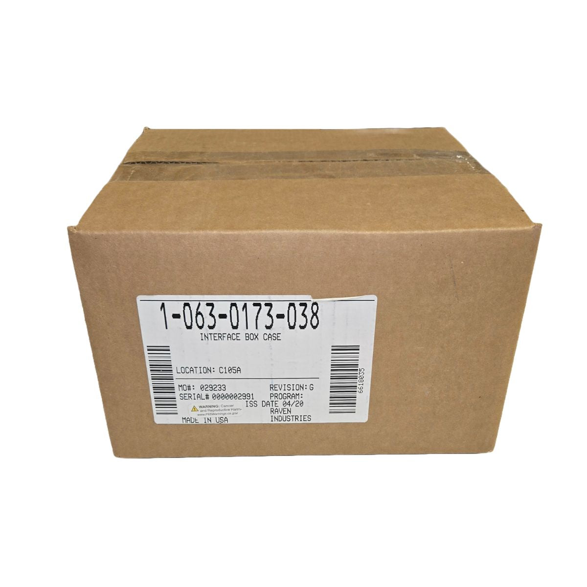 A brown Raven Interface Box (063-0173-038), CAN Bus compatible for Case equipment, with a white detailed label.