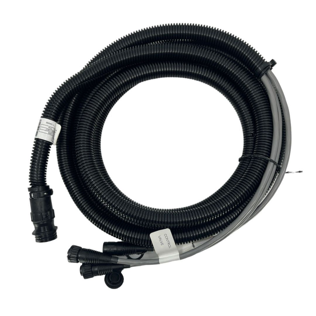 The Raven Cable 12' Prod NH3 Single Sec, a coiled black hose with connectors at both ends and tags indicating specifications, is set against a white background. This extension is specifically designed for compatibility with Raven Precision NH3 Cable systems, making it an ideal choice for use with SCS 4400/4600 controllers.