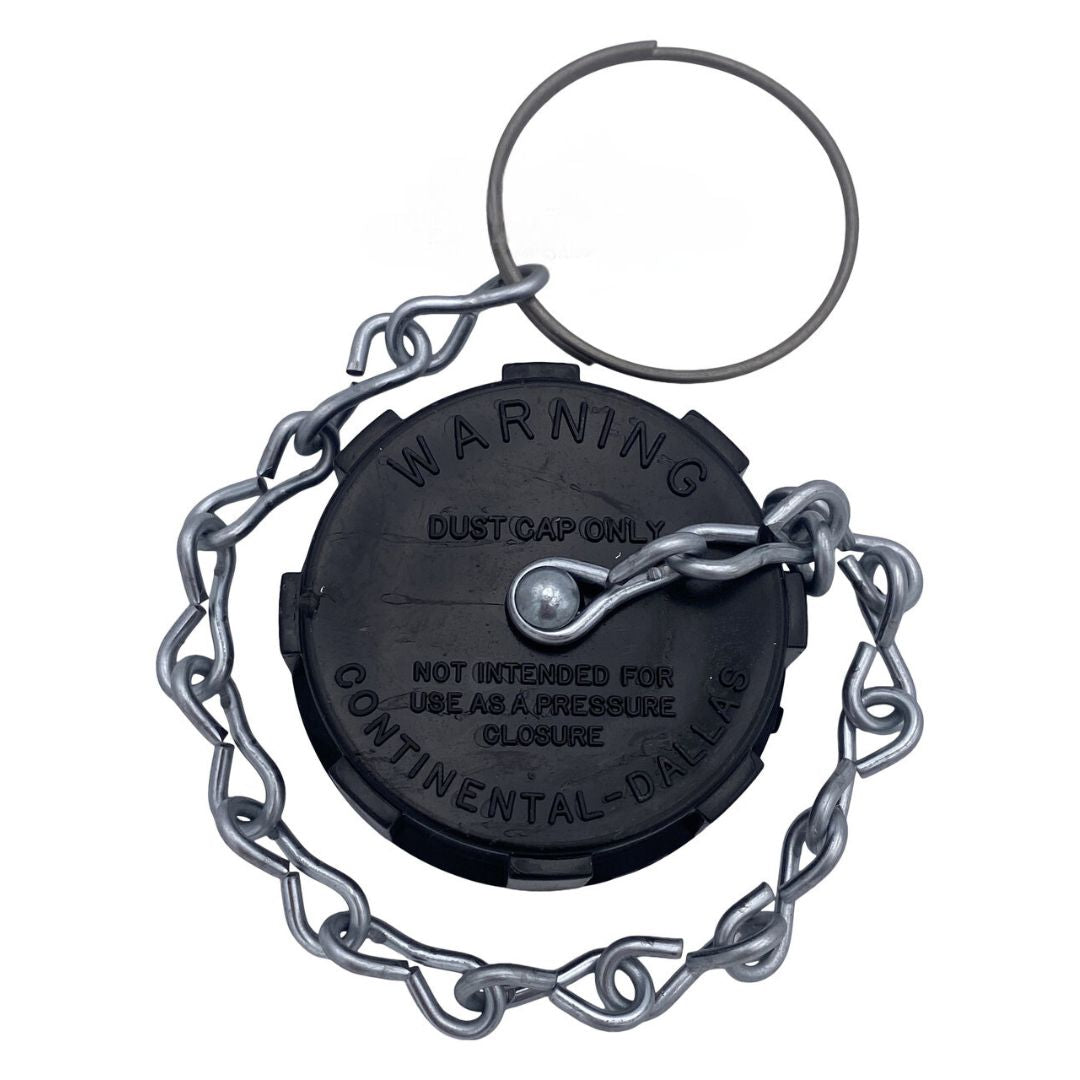 The Continental NH3 1-3/4" ACME Replacement Dust Cap with Chain is engineered for cryogenic applications and showcases a black circular design complete with a safety chain and metal ring. Warning text is engraved on its surface to ensure secure use in agricultural fittings.