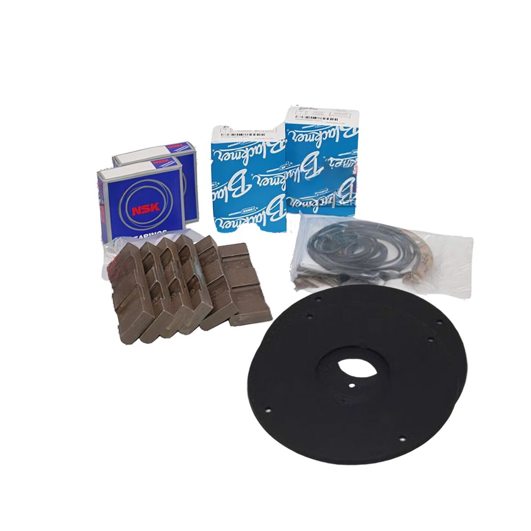 Assorted mechanical parts, including bearings, brake pads, seals, and a round black mounting plate against a white background—perfect for maintaining Blackmer 4" LPG pumps using the Blackmer Maintenance Kit - 4" LPG Pump Service | LGLD4, TLGLF4B (898922).