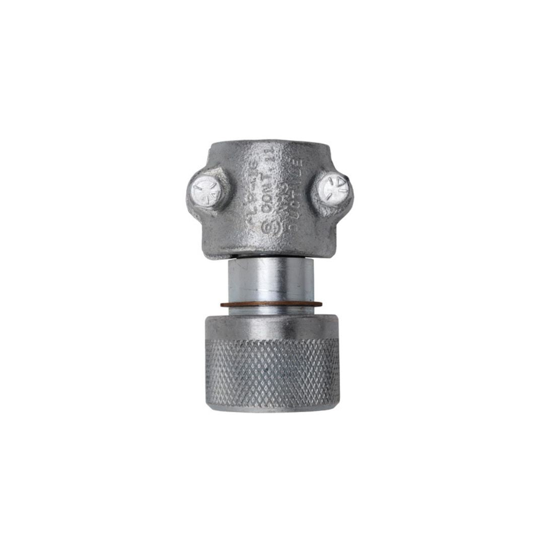 The Continental Hose Coupling 1-1/4" x 1-3/4" Female ACME 2-Bolt Clamp Type, featuring a knurled grip and visible bolts, is ideal for secure NH3 hose connections in agricultural environments. Engineered for durability, it's perfect for managing anhydrous ammonia applications.