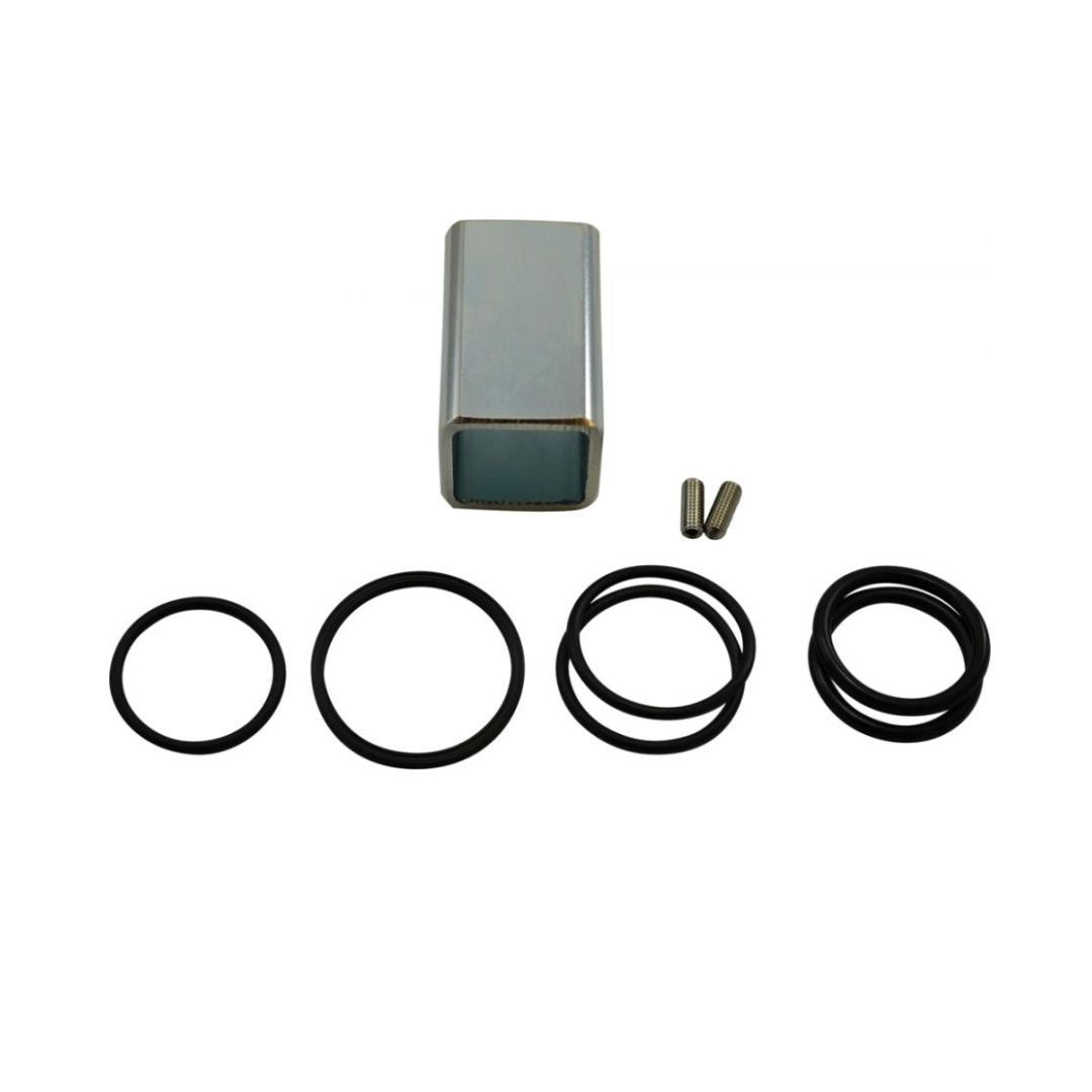 A small rectangular metal case, two small metal pins, and six black rubber O-rings of different sizes arranged on a white background form the Squibb Taylor Flo-Max Safety Coupler O-Ring Repair Kit with Tool (FM125-0022).