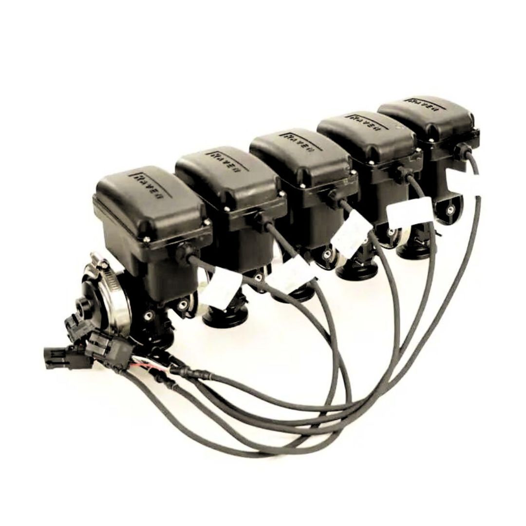 A row of four Raven 5-Section Manifold Boom Valves, arranged neatly against a white background, showcases their compatibility with industrial applications, ensuring seamless integration and efficiency.
