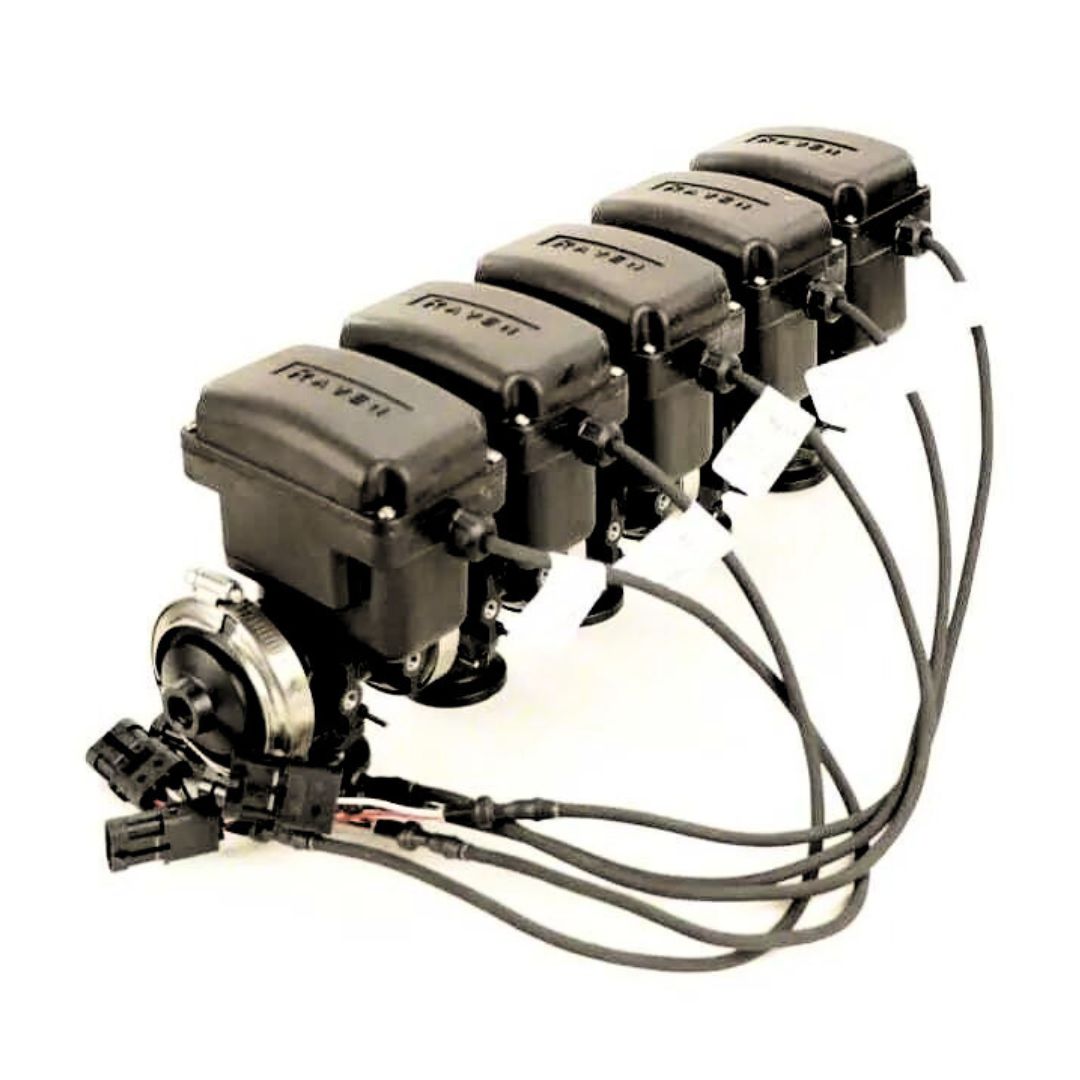 Five Raven 5-Section Manifold Boom Valves, designed in sleek black for industrial use, are connected by cables and aligned in a row, with labels and connectors clearly visible.