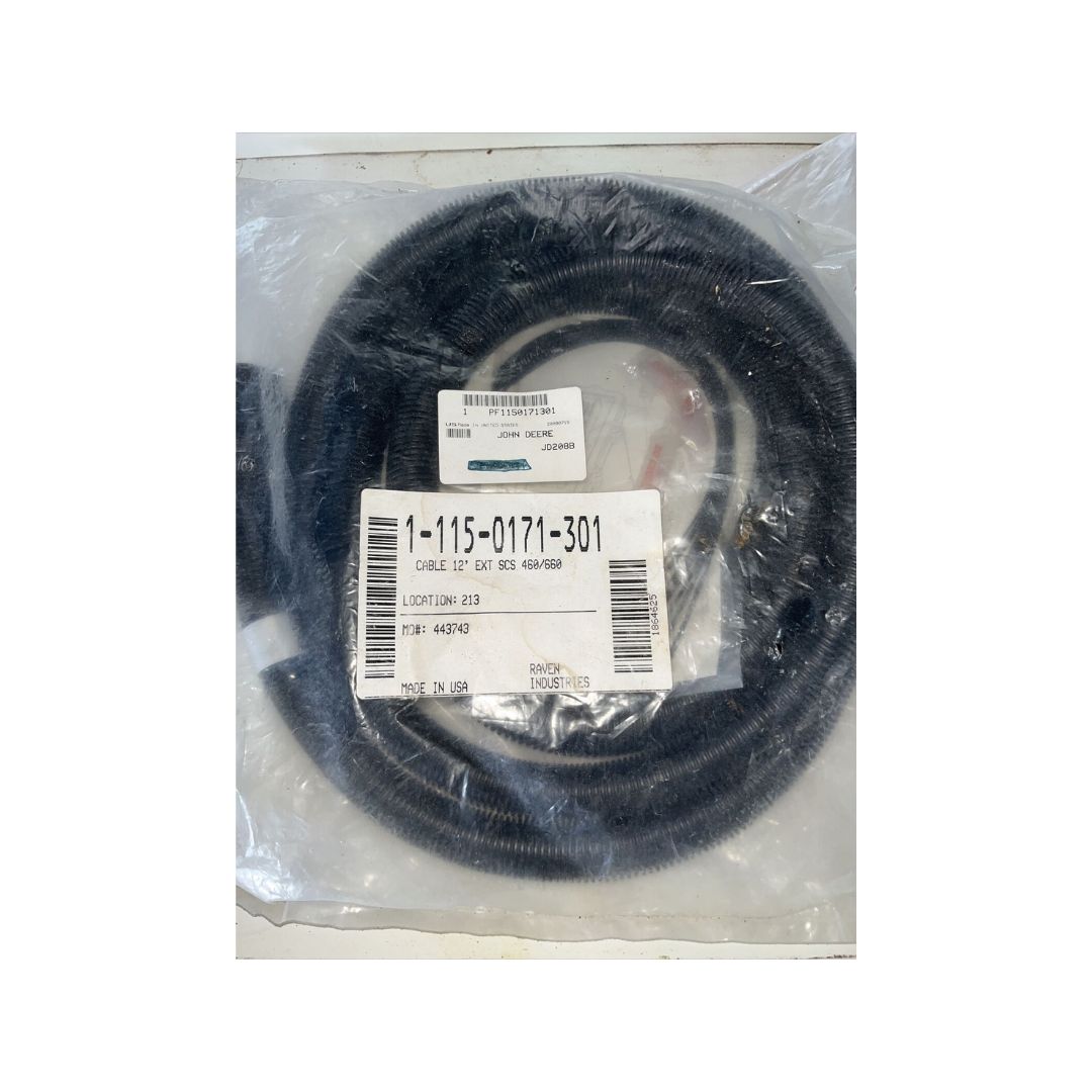 Coiled black Raven 12' Cable Extension SCS 460/660 in transparent plastic packaging with multiple labels displaying product information and barcodes.