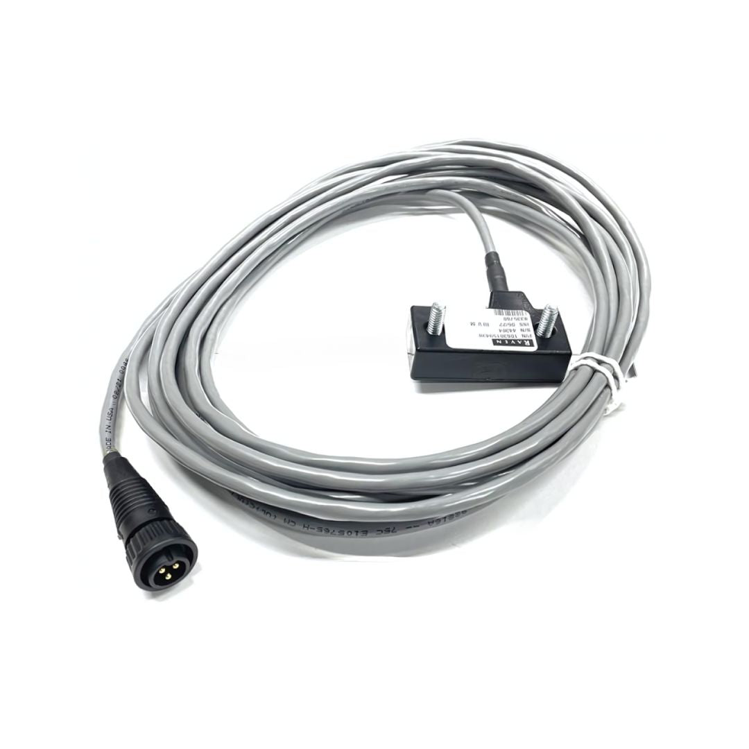 A 21-foot, coiled gray electric cable with a black connector and a labeled rectangular component at the end, designed for use in Raven Systems' agricultural equipment speed sensor, available under the name "Raven Wheel Drive Speed Sensor Kit - 4 Magnet (063-0159-484).