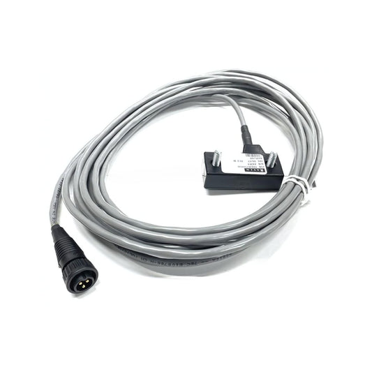 Long, coiled gray cable with a three-pin connector on one end and a black rectangular module labeled '063-0159-438' on the other end, used for connecting equipment or sensors in electronic or industrial applications