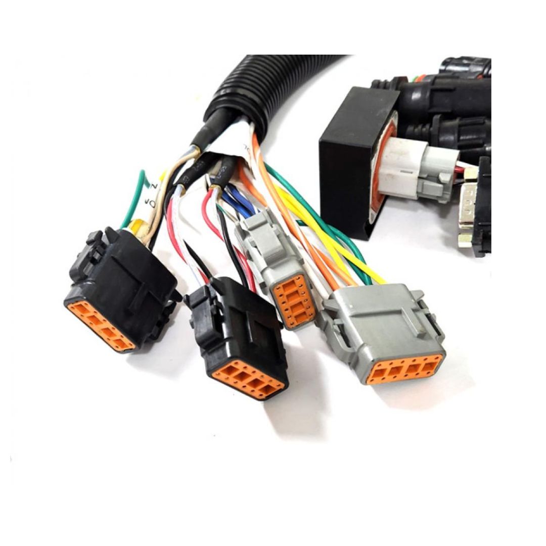 Close-up of multiple electrical connectors with colorful wires emerging from each, showcasing orange, black, and grey housings. The setup is reminiscent of the Raven Interface Adapter Cable - 2' Viper Pro to 460/660/661 (115-0171-763) used in AGCO equipment or for connecting Viper Pro and Envizio Pro systems.