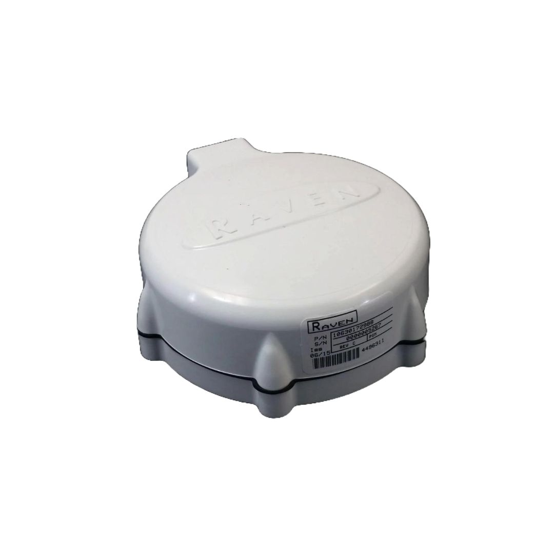 A white, circular Raven GPS antenna, known as the Phoenix 10 GPS Speed Sensor, with a barcode and specifications on the side; it is ideal for agricultural applications and compatible with Raven controllers.